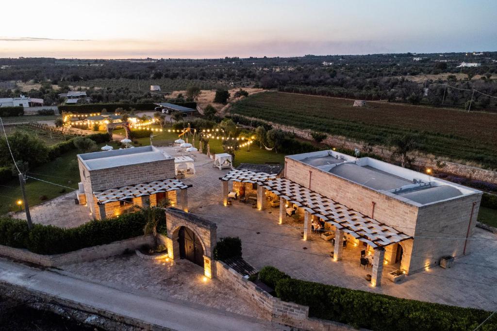 an aerial view of a building with lights at Dimora Soleda in Torre San Giovanni Ugento