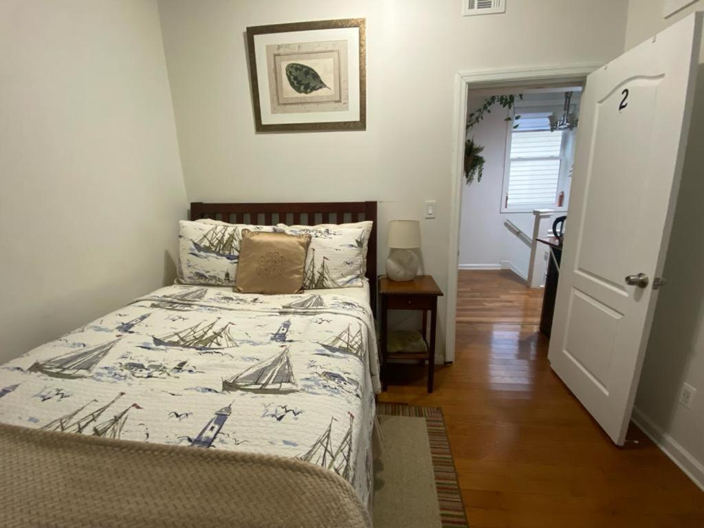 a bedroom with a bed with a comforter on it at Dayton Dream in Newark