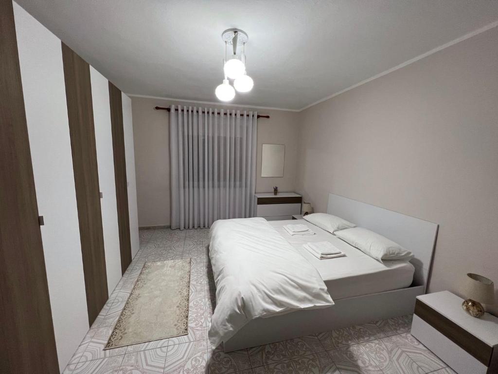 A bed or beds in a room at Home Shkodra Center