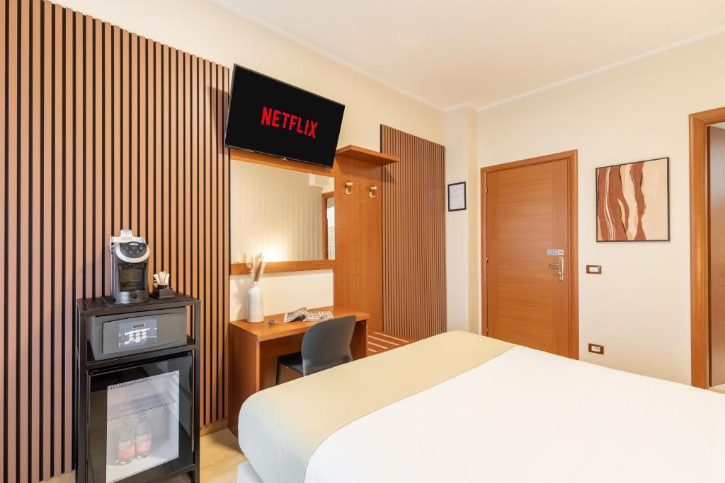 Łóżko lub łóżka w pokoju w obiekcie AlbaDomus Affittacamere o GuestHouse