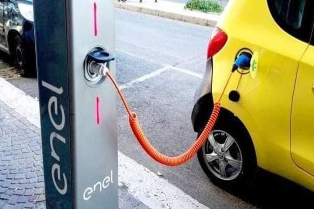 an electric car is being charged at a gas station at Venere B&B in Catania