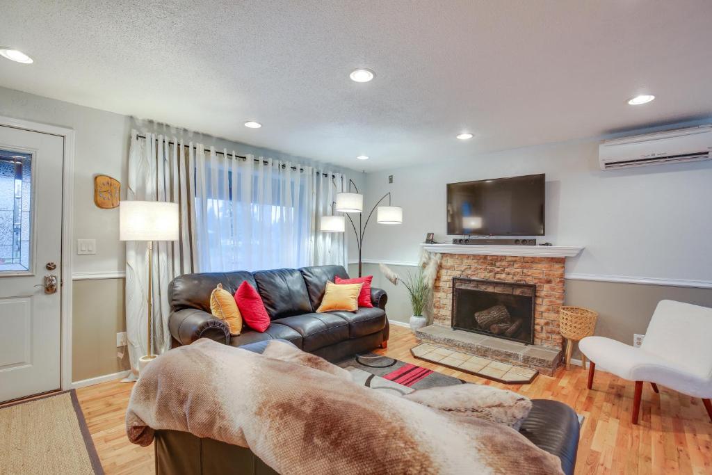 a living room with a couch and a fireplace at Eugene Vacation Home 8 Mi to University of Oregon in Eugene