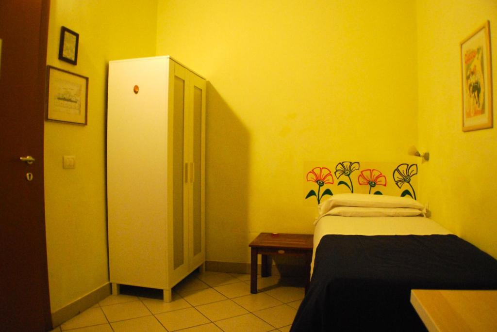 Postel nebo postele na pokoji v ubytování AlbergoTeatro