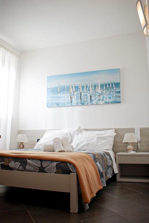 Cama o camas de una habitación en Pensione Sorriso