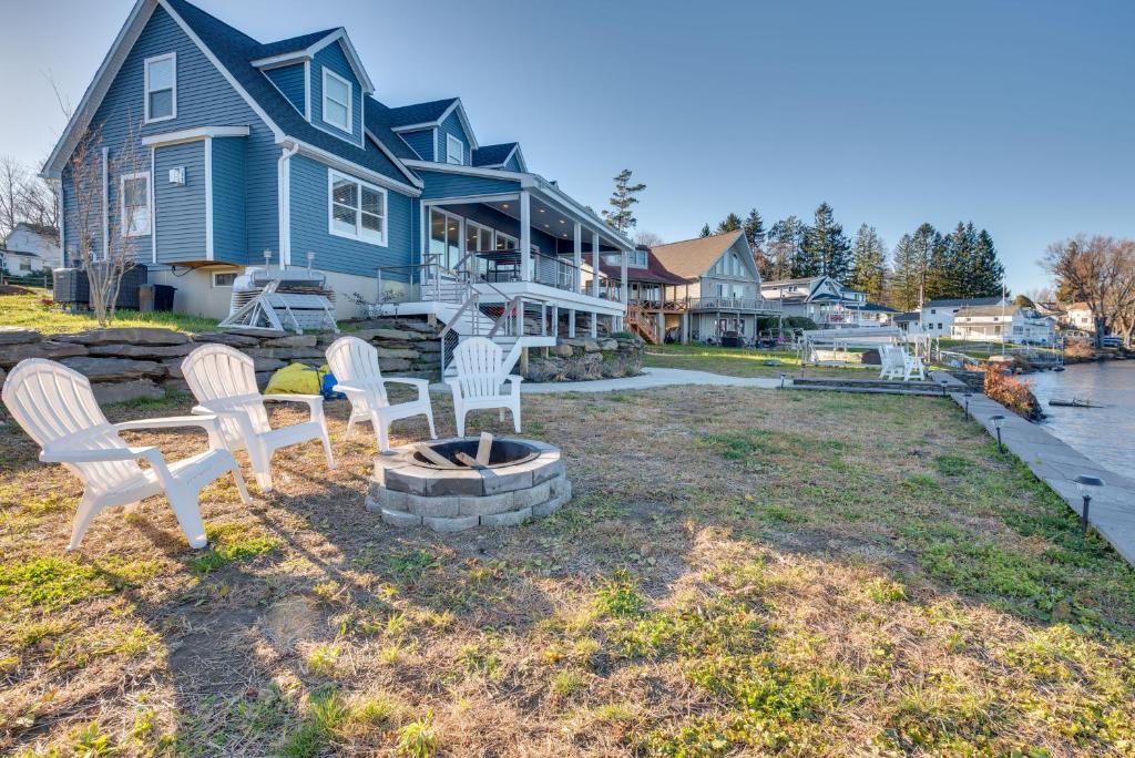 a group of chairs sitting in front of a house at Family Home on Lake Newton with Deck and Fire Pit in Carbondale