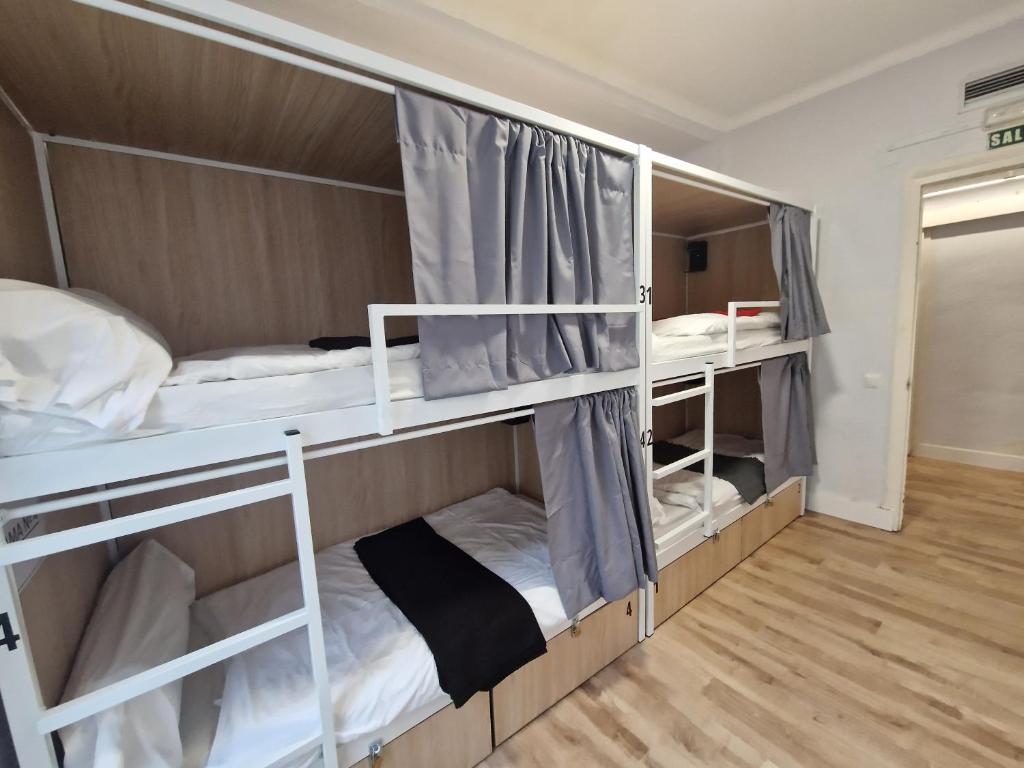 Posteľ alebo postele v izbe v ubytovaní Aloha Hostel