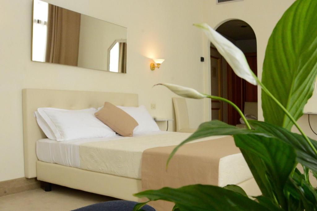 Postel nebo postele na pokoji v ubytování Hotel Ponte di Rialto