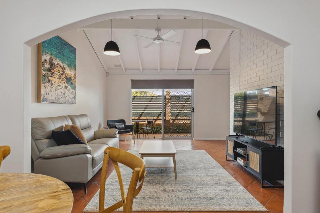 a living room with a couch and a table at NORM3/17 - Little Hacienda in Perth
