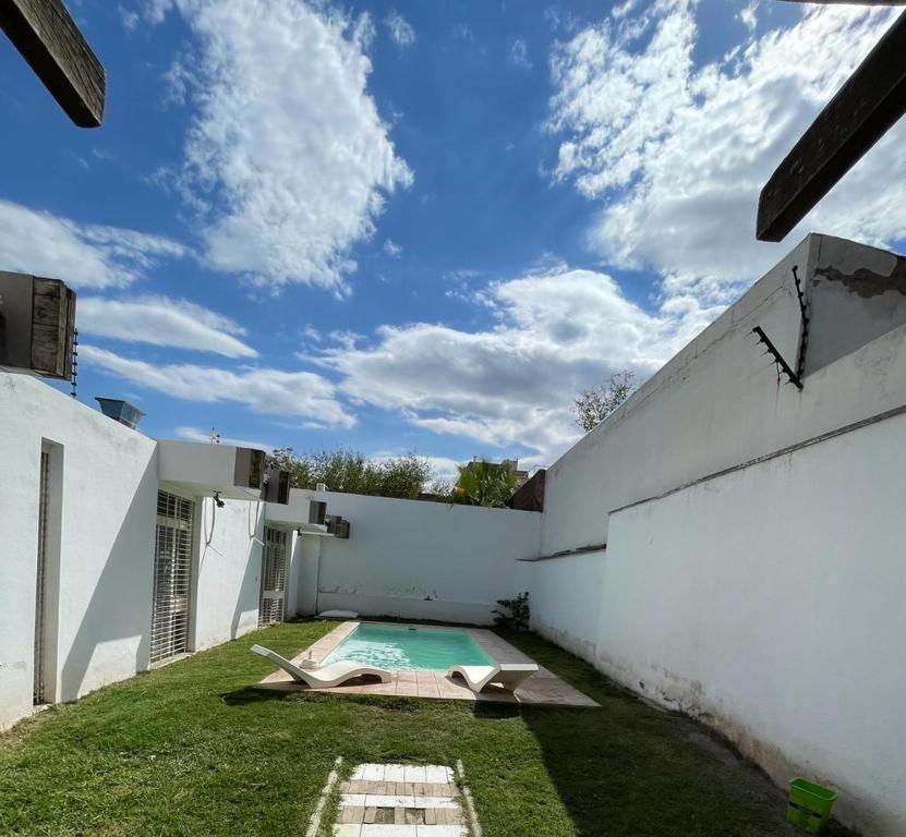 a swimming pool in the backyard of a house at Casa Barrio Bombal in Mendoza