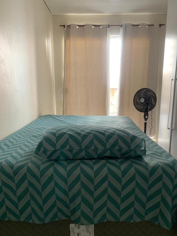 Кровать или кровати в номере Férias e Trabalho