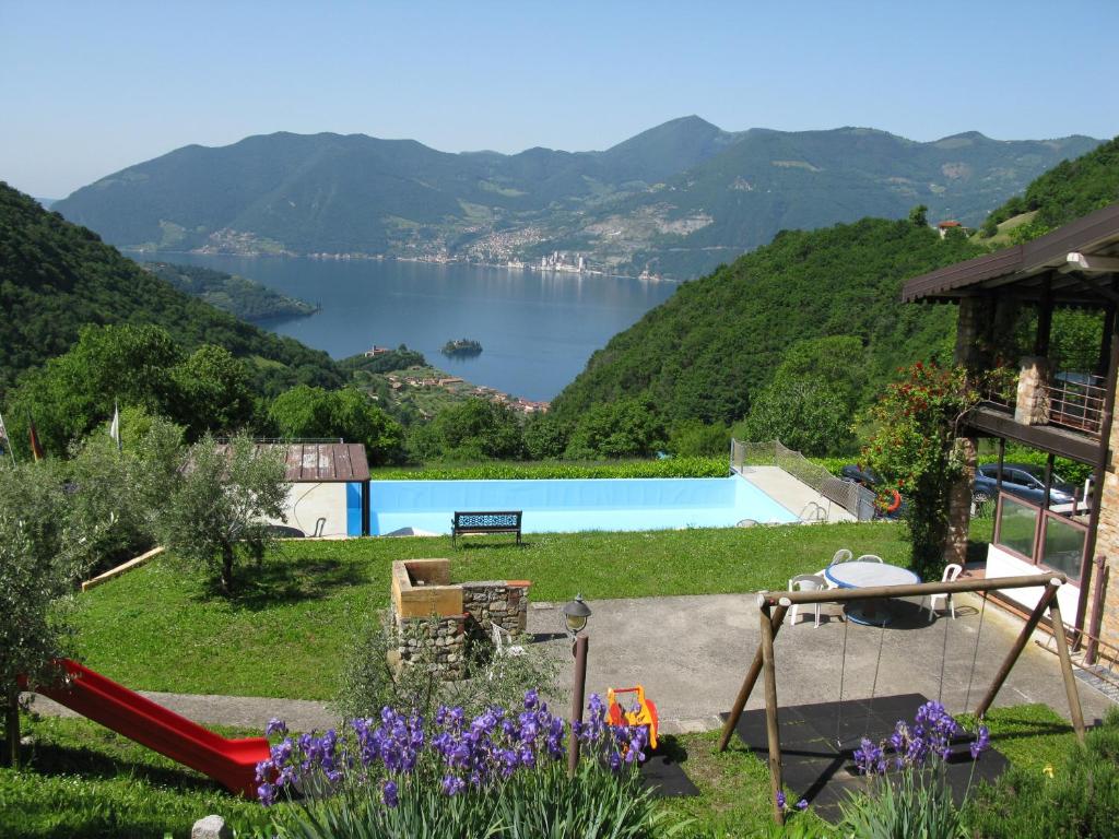 a garden with a view of a lake at Chalet della Rota in Marone