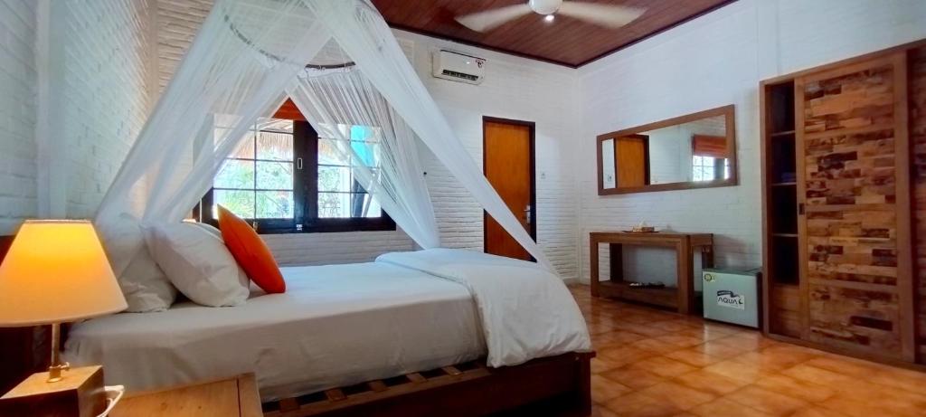 Postel nebo postele na pokoji v ubytování Amrita Maumere Resort
