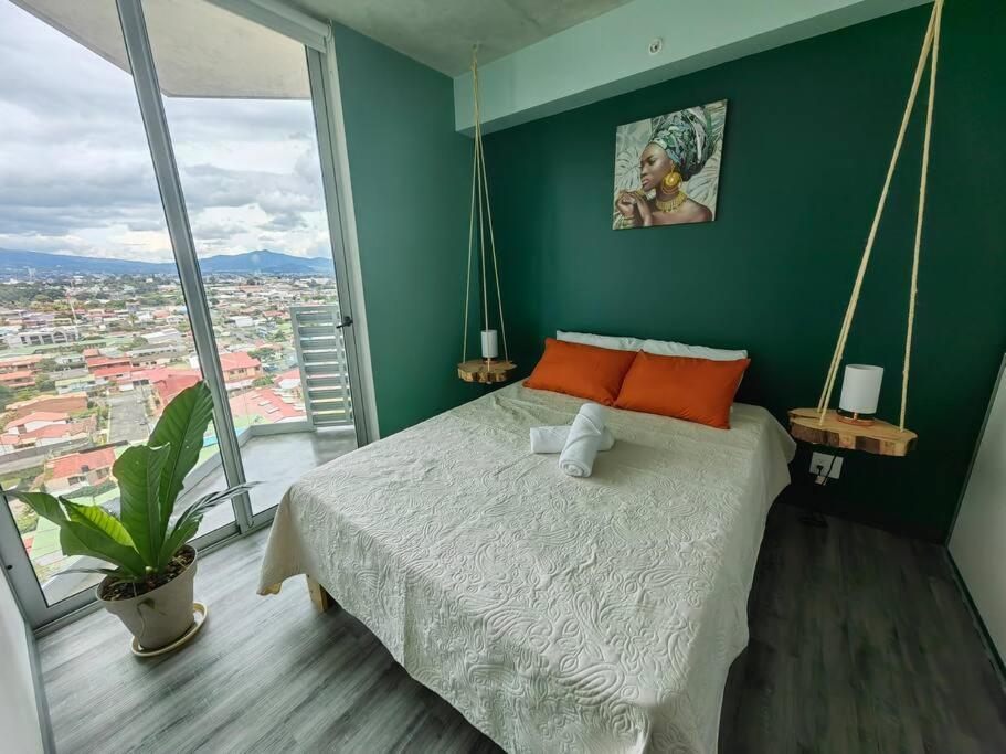 Postel nebo postele na pokoji v ubytování 1515 SECRT Sabana Hermoso Apartamento Equipado con Aire Acondicionado