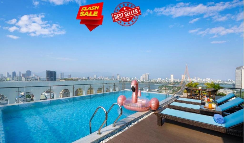 a large swimming pool on the roof of a building at Gold Plaza Hotel Da Nang in Danang