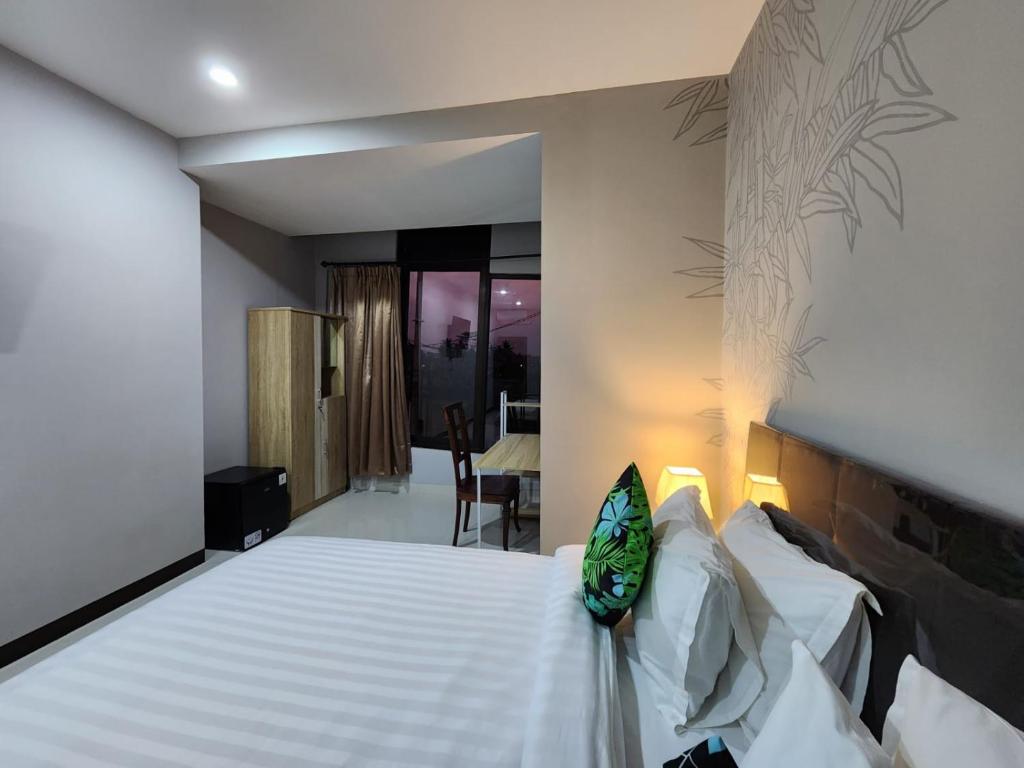 Postel nebo postele na pokoji v ubytování Hepi Yuk Ubud Luxury Guesthouse