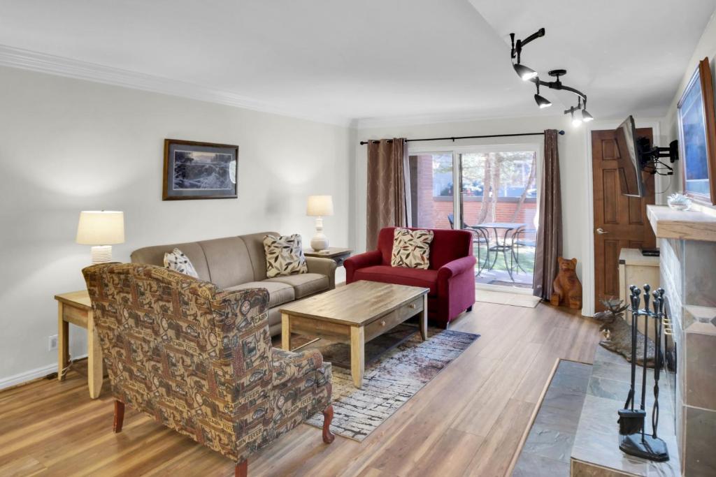 a living room with a couch and two chairs at PARK STATION 113 condo in Park City