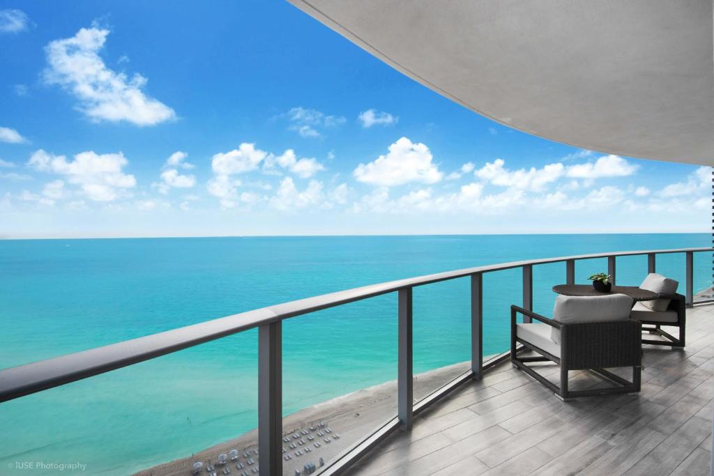 a balcony with a view of the ocean at Zen Vacation Rentals Ocean Front at Lyfe Resort in Hollywood