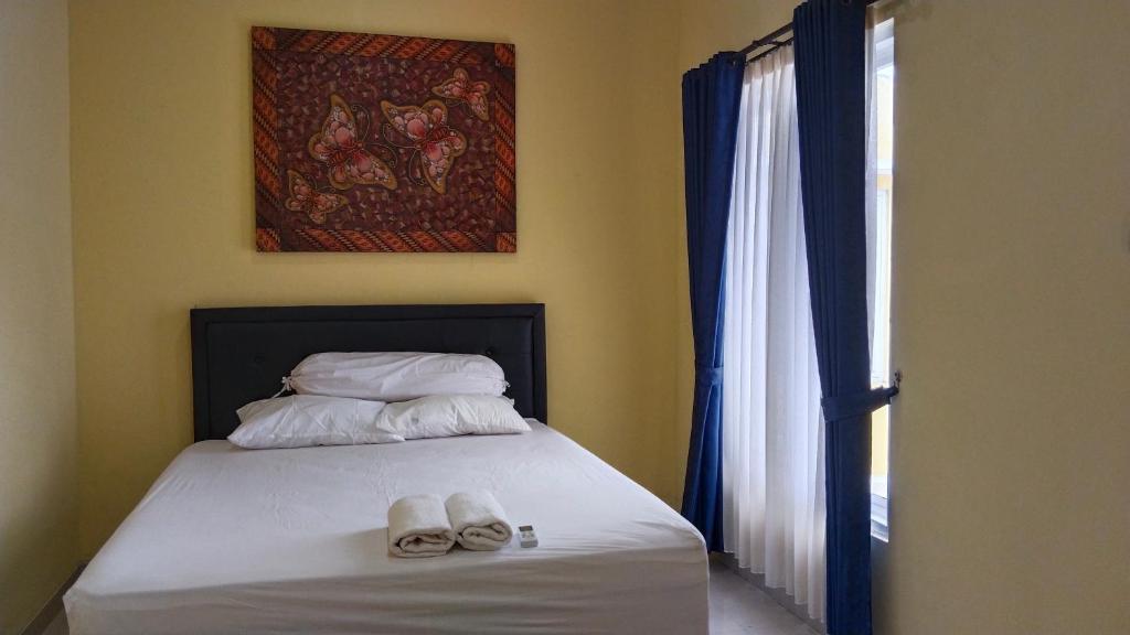 Voodi või voodid majutusasutuse Hans Bali Guest House toas