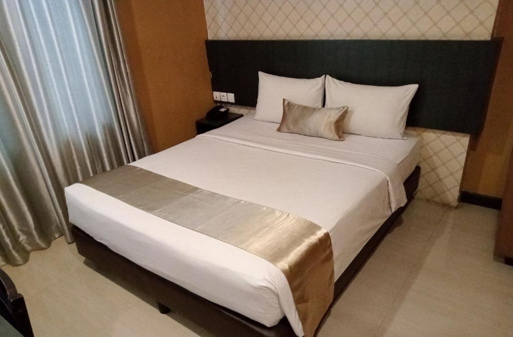 Postel nebo postele na pokoji v ubytování CREW EXPRESS Hotel