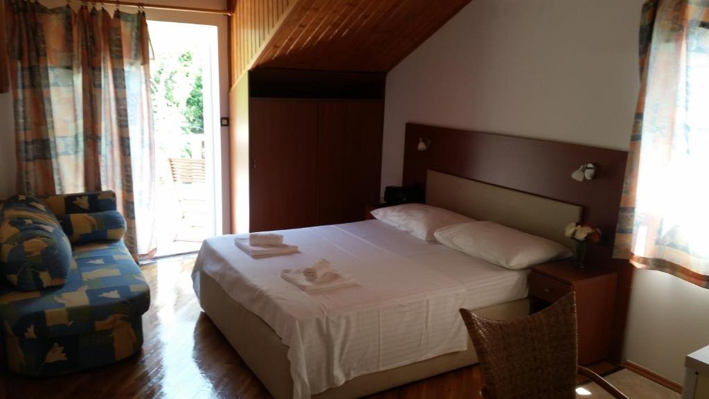 Postel nebo postele na pokoji v ubytování Apartments Vile Holiday