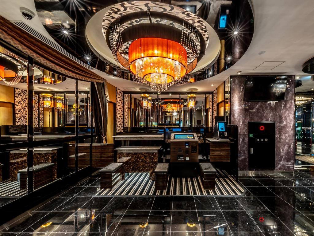 a lobby of a restaurant with a chandelier at APA Hotel Kayabacho Hachobori Ekimae in Tokyo