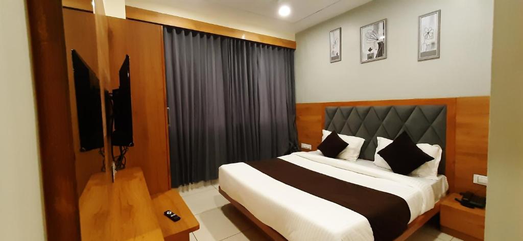 Postel nebo postele na pokoji v ubytování Hotel Suncity