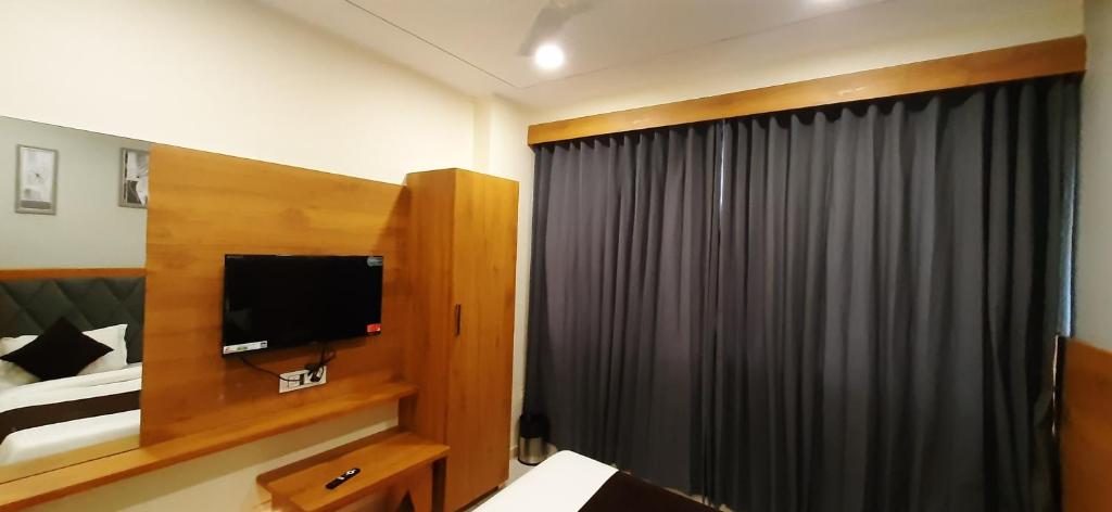TV a/nebo společenská místnost v ubytování Hotel Suncity