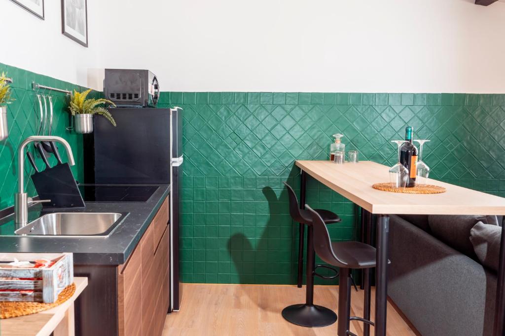 Kuchyň nebo kuchyňský kout v ubytování SambaSS Boutique Apartment