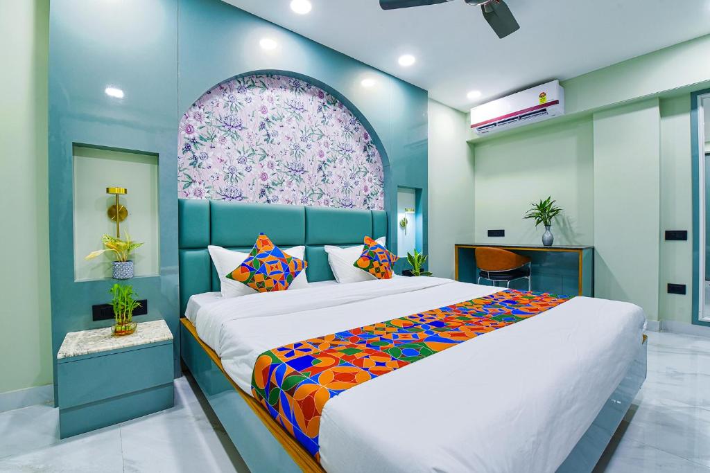 A bed or beds in a room at FabHotel Subh Hari
