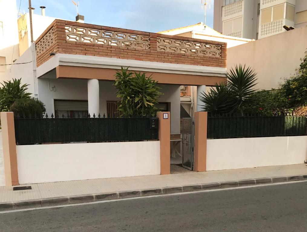 a house on the side of a street at El Chalet de Lola in Playa de Miramar