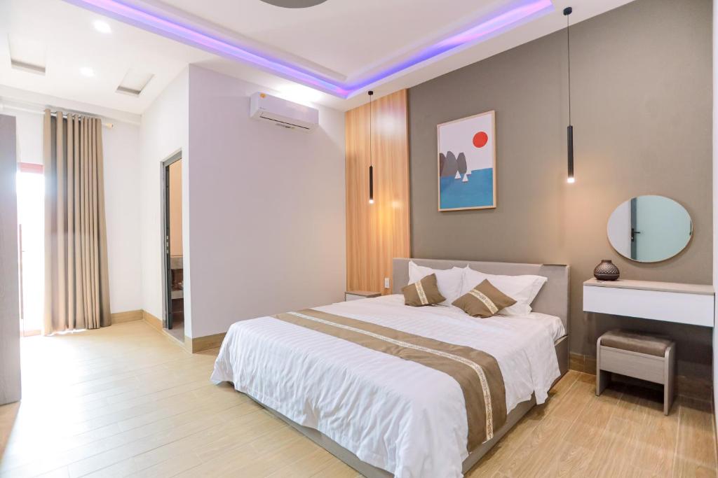 Ένα ή περισσότερα κρεβάτια σε δωμάτιο στο Every Day Guest House - Phan Thiet