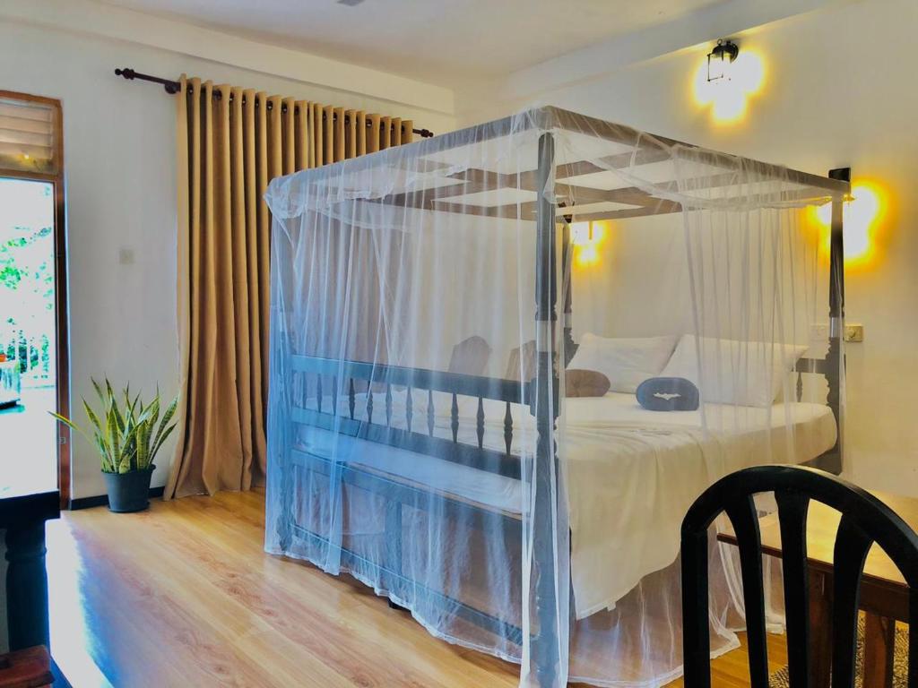 Postel nebo postele na pokoji v ubytování Mirissa Beach Inn