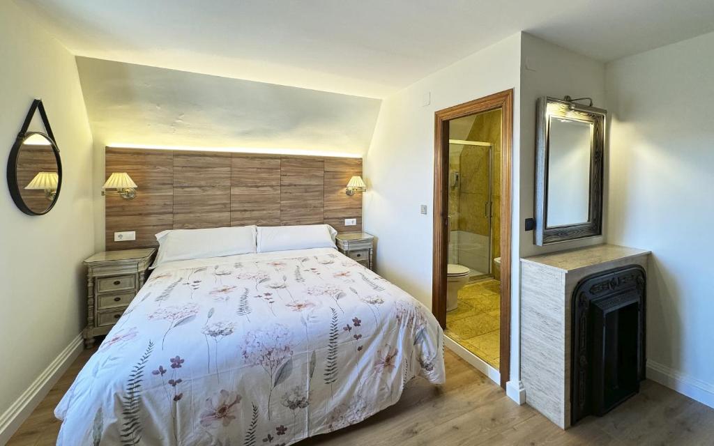 Łóżko lub łóżka w pokoju w obiekcie Posada Villa Rosa