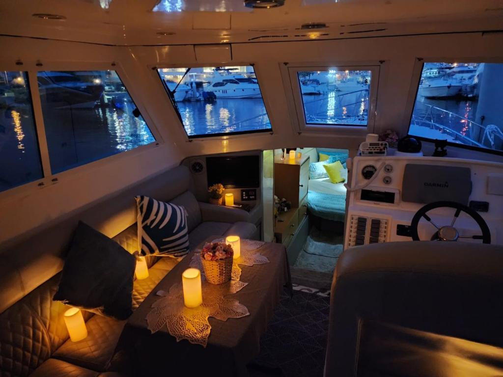 a view of a living room on a boat at A special 24 hours yacht stay in Manama