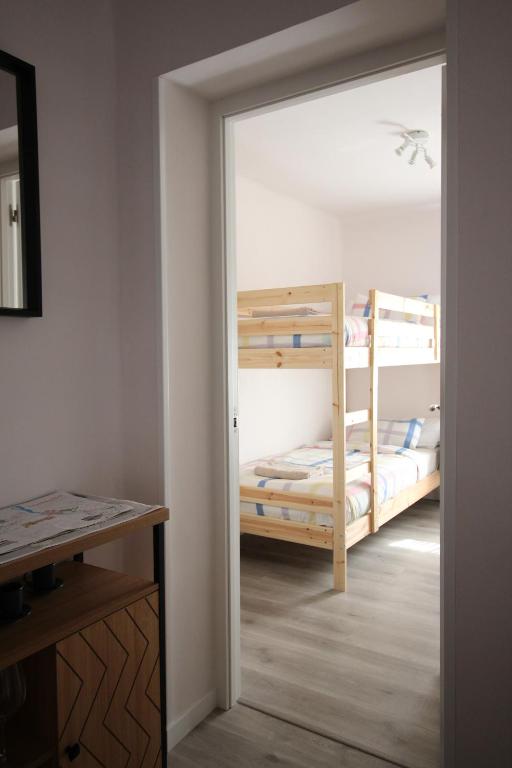 A bed or beds in a room at Cómodo piso en el Pirineo Aragonés