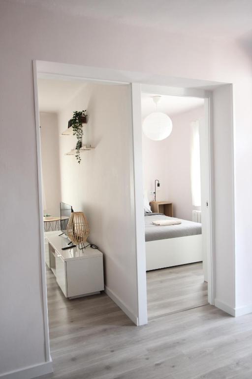 A bed or beds in a room at Cómodo piso en el Pirineo Aragonés