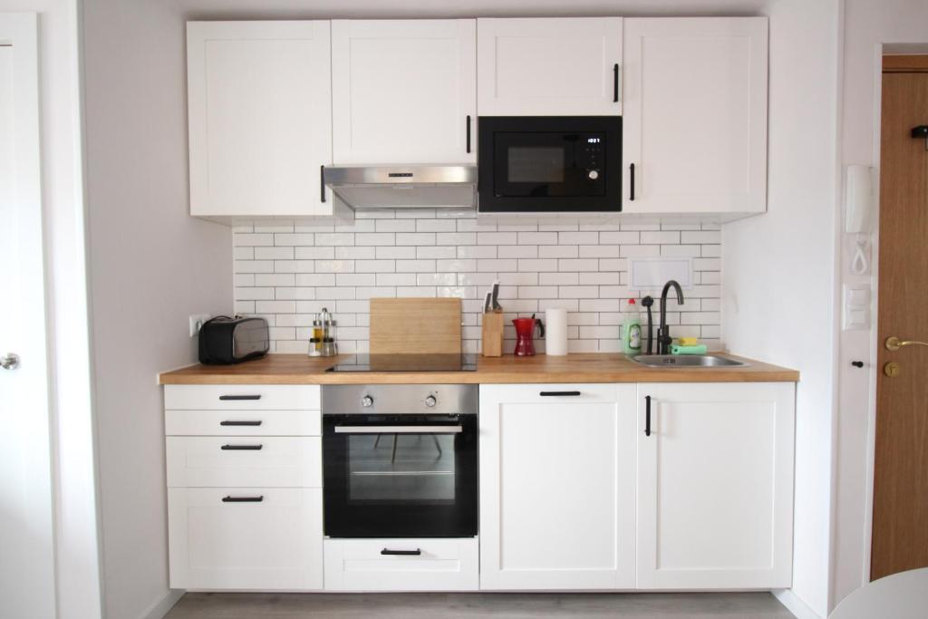 A kitchen or kitchenette at Cómodo piso en el Pirineo Aragonés