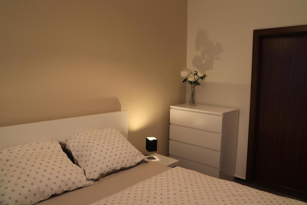 Postel nebo postele na pokoji v ubytování Apartmán U Parku