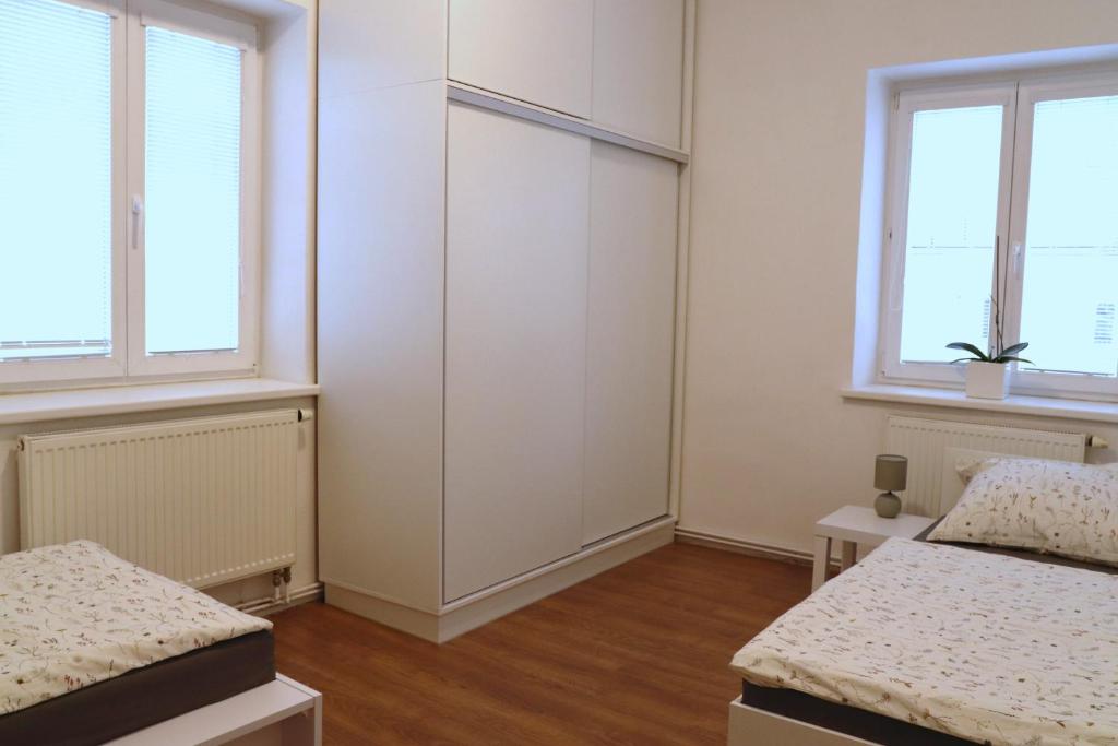 Postel nebo postele na pokoji v ubytování Apartmán U Parku