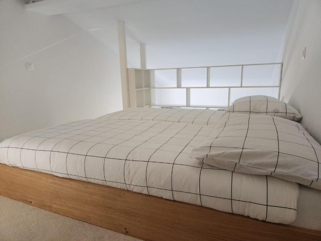 Postel nebo postele na pokoji v ubytování Aaki Apartment Diegten II