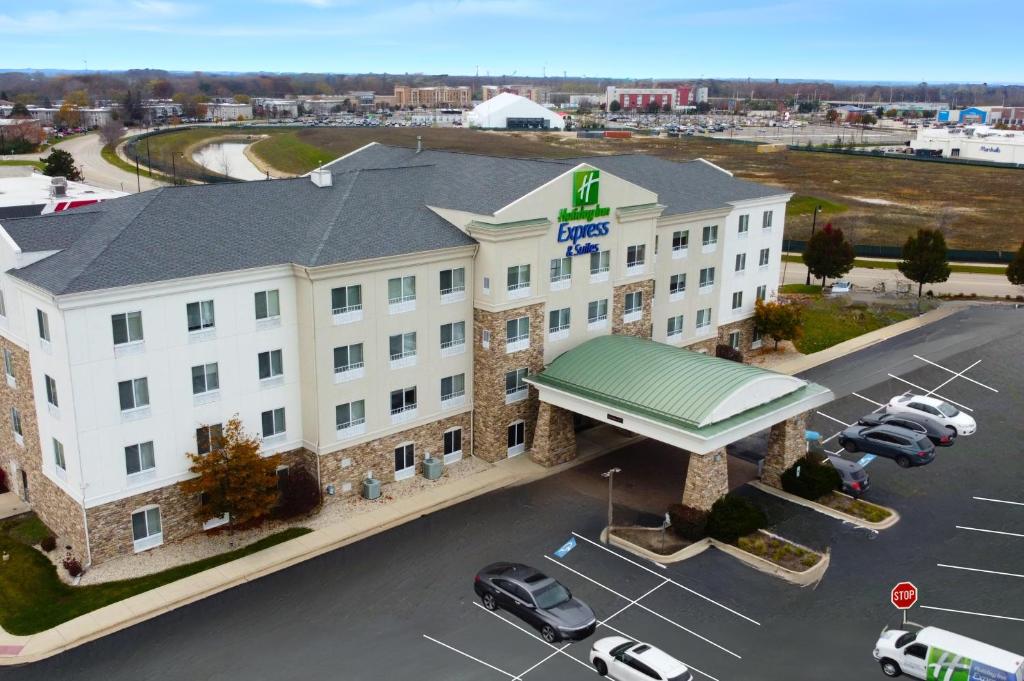 an aerial view of a hotel with a parking lot at Holiday Inn Express Hotel & Suites Waukegan/Gurnee, an IHG Hotel in Waukegan