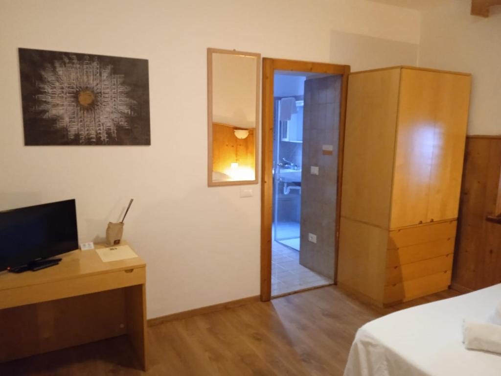 Postel nebo postele na pokoji v ubytování HOTEL BRUSTOLON