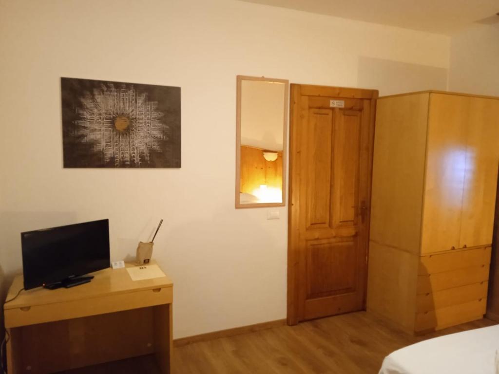 Postel nebo postele na pokoji v ubytování HOTEL BRUSTOLON