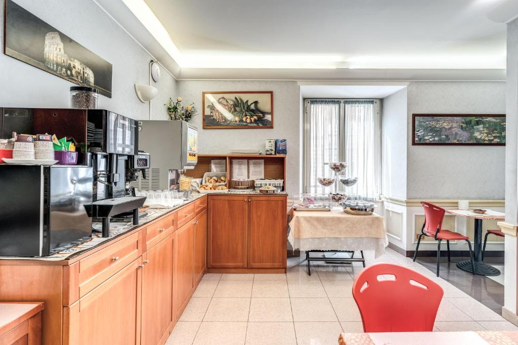 Kuchyň nebo kuchyňský kout v ubytování Hotel Milo