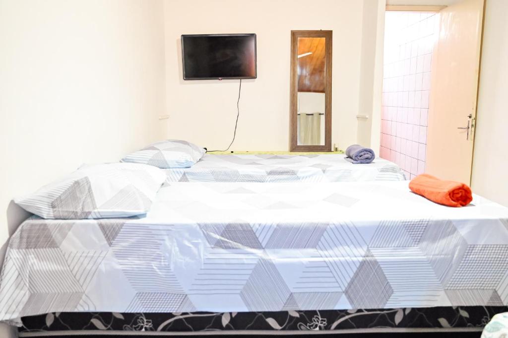 Postel nebo postele na pokoji v ubytování Hostel mineiros