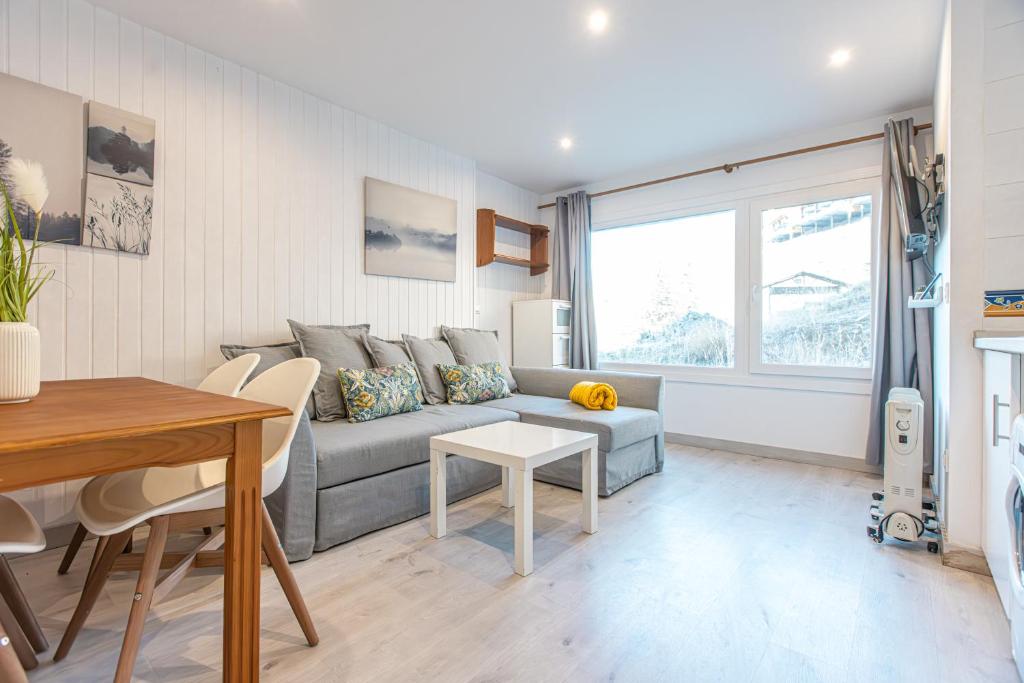 a living room with a couch and a table at Apartamento Nature in Sierra Nevada