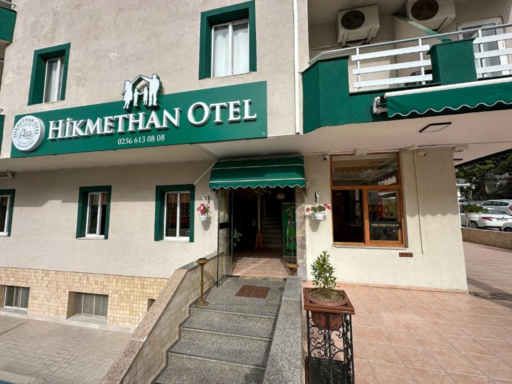 a building with an elephant sign on the front of it at Hikmethan Otel in Kusadası