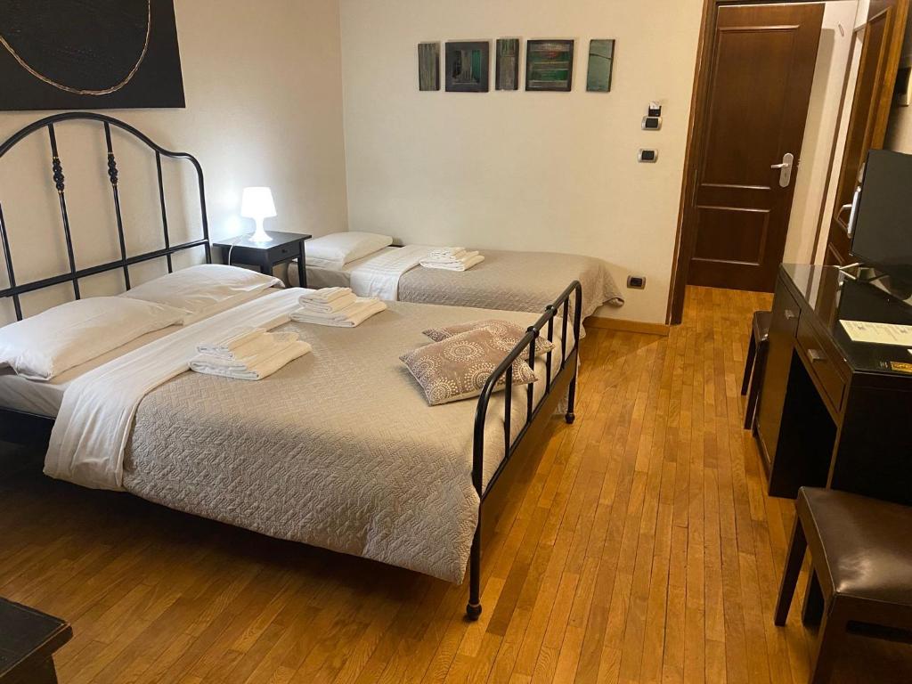 Posteľ alebo postele v izbe v ubytovaní Stefano House appartamento Fontana di Trevi