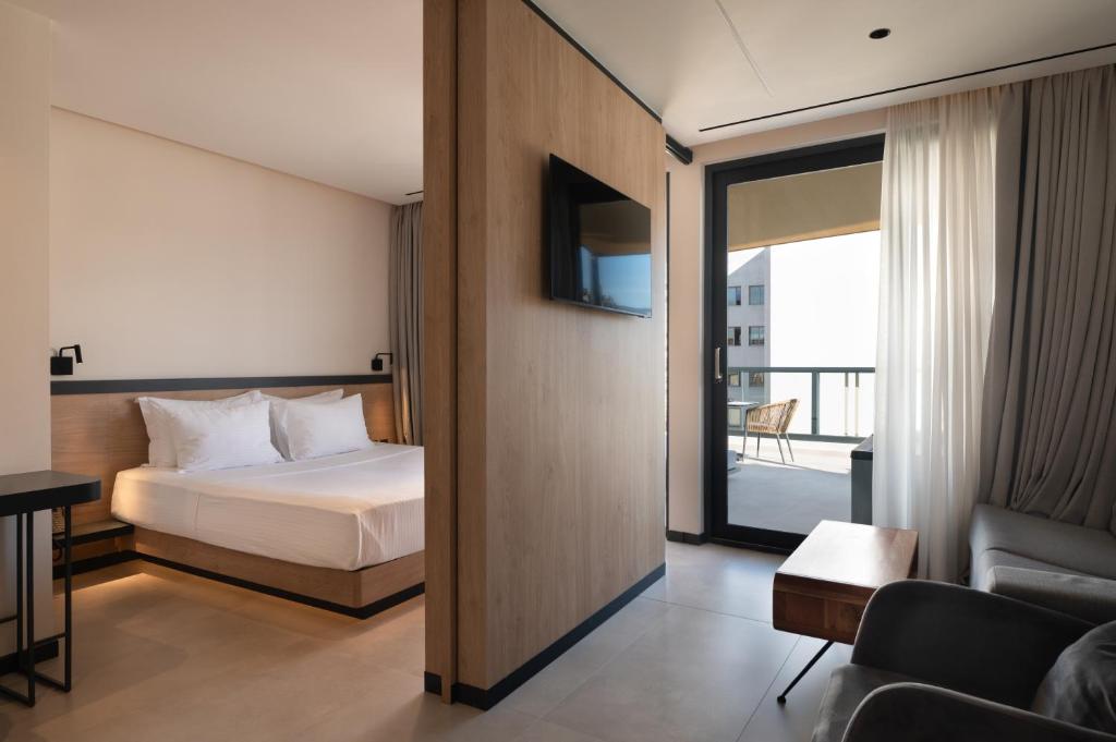 Ένα ή περισσότερα κρεβάτια σε δωμάτιο στο Nema Hotel Athens