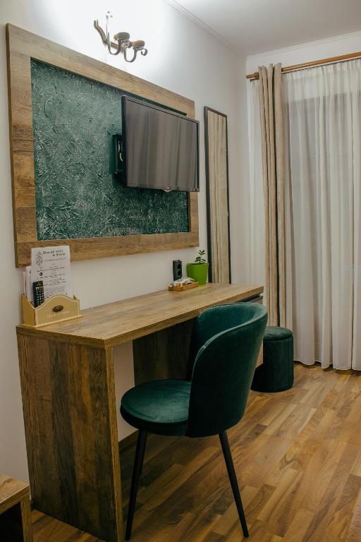 TV a/nebo společenská místnost v ubytování Casa Traian